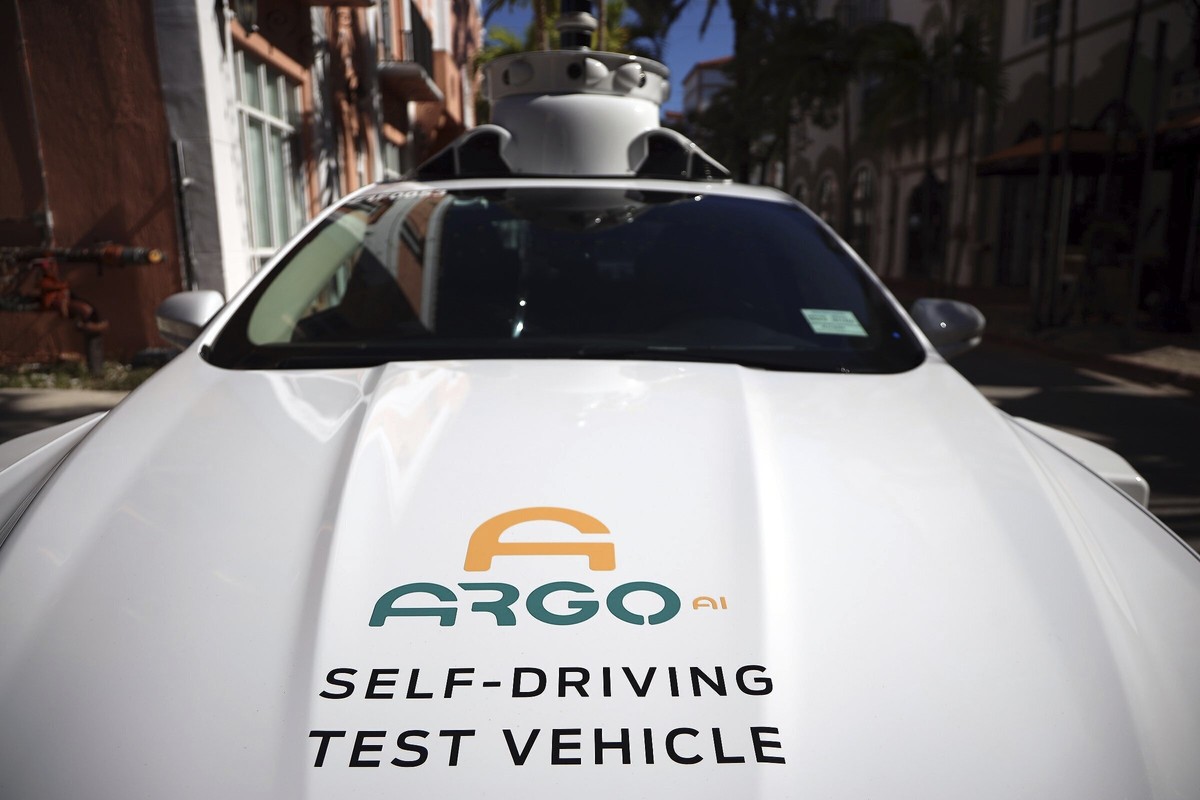 FILE - An experimental autonomous vehicle arrives for a drop-off, Dec. 8, 2020, in Miami Beach, Fla. The autonomous vehicle technology company that partners with Ford and Volkswagen says it has starte ...