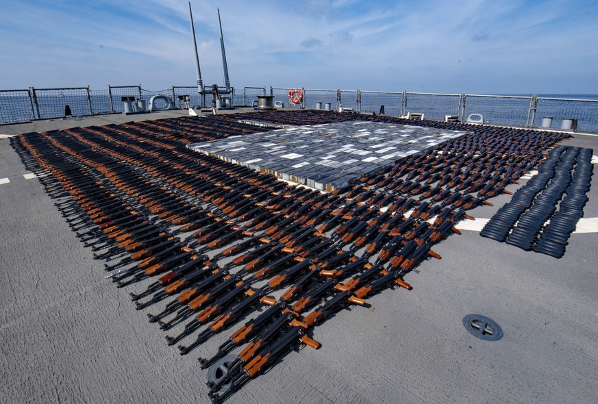 In this Dec. 21, 2021, photo released by the U.S. Navy, Illicit weapons seized from a stateless fishing vessel in the North Arabian Sea are arranged for inventory aboard guided-missile destroyer USS O ...