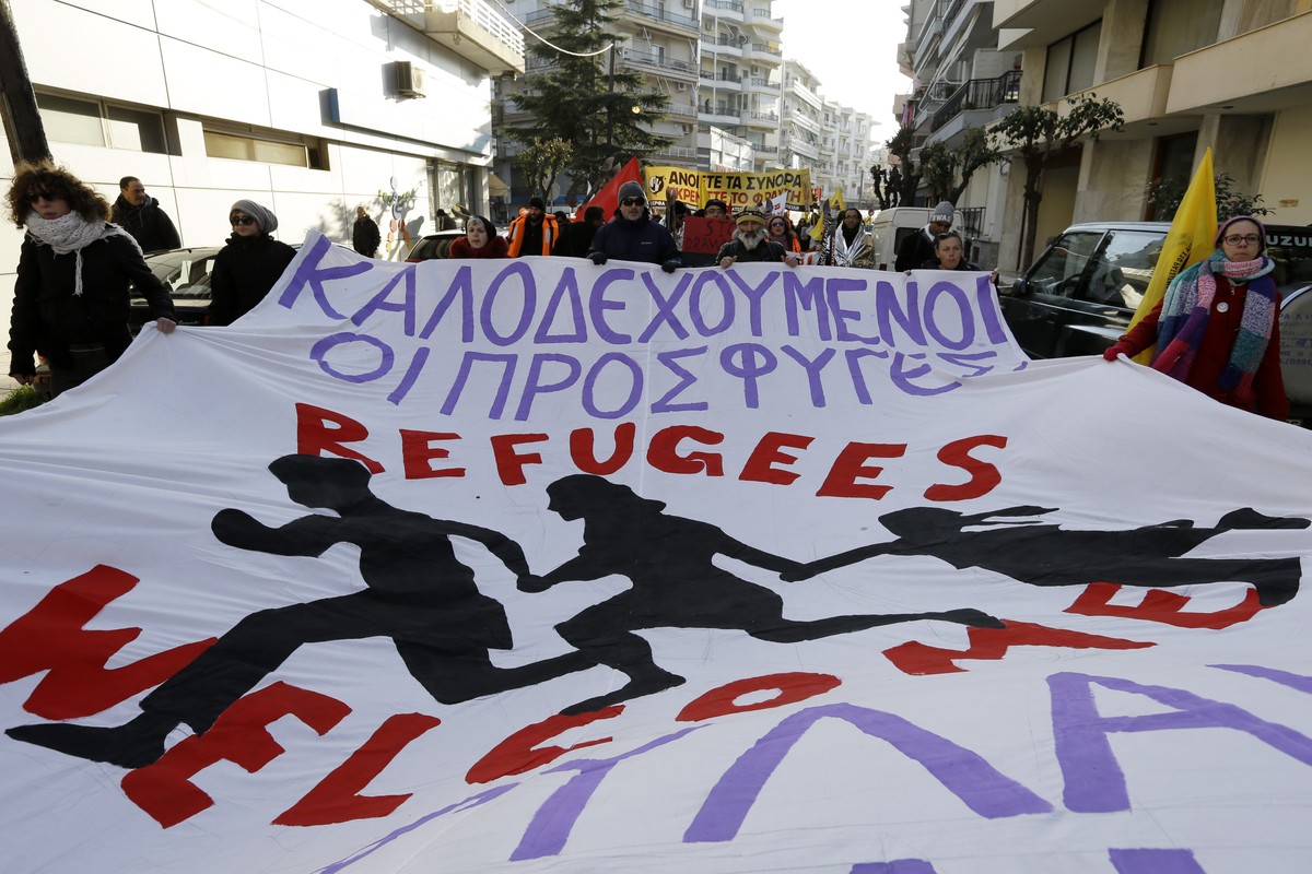 A left-wing group holds a banner reading in Greek and English "refugees welcome" during a solidarity rally for the refugees and migrants at the border town of Alexandroupolis, northeastern G ...