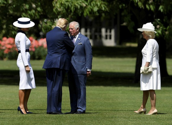 Britain&#039;s Prince Charles, second right, and Camilla, Duchess of Cornwall meet US President Donald Trump, second left, and his wife Melania as they arrive at Buckingham Palace, in London, Monday,  ...