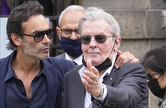 French actor Alain Delon and his son Anthony Delon, left, arrive at the Saint Germain des Pr