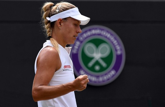 epa06875340 Angelique Kerber of Germany plays Belinda Bencic of Switzerland in their fourth round match during the Wimbledon Championships at the All England Lawn Tennis Club, in London, Britain, 09 J ...