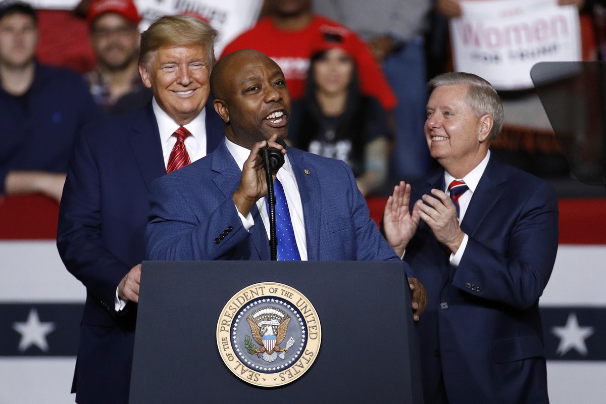 FILE - Sen. Tim Scott, R-S.C., speaks in front of President Donald Trump and Sen. Lindsey Graham, R-S.C., during a campaign rally, Friday, Feb. 28, 2020, in North Charleston, S.C. Scott has filed pape ...