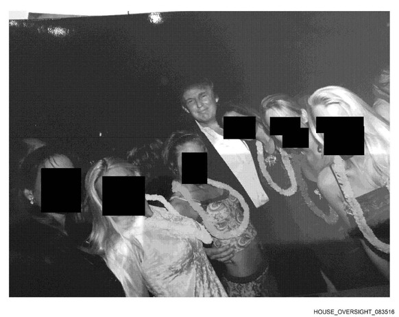This undated, redacted photo released by Democrats on the House Oversight Committee shows Donald Trump standing with a group of women. (House Oversight Committee via AP)
Trump Epstein Congress