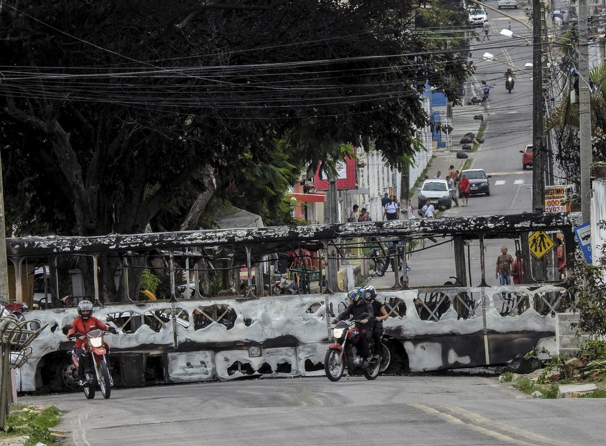 epa10523063 A burnt public service bus in Natal, in the state of Rio Grande do Norte, Brazil, 14 March 2023. The Brazilian government announced on 14 March that it will send a special police force to  ...