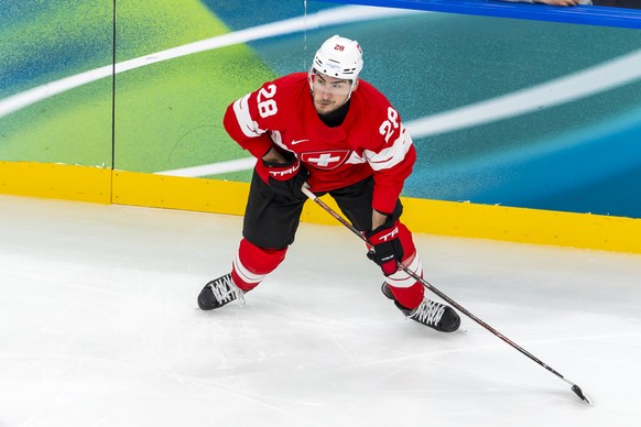 Switzerland's Timo Meier controls the puck, during the men's group A preliminary round game between Switzerland and Czech Republic at the 2026 Olympic Winter Games in Milan Santagiulia Ice H ...