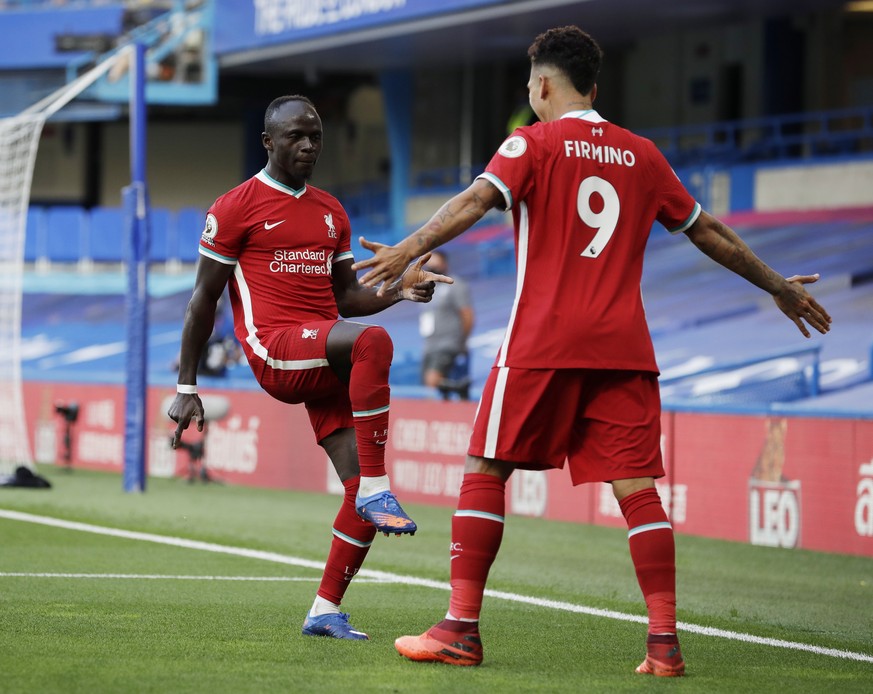 epa08684513 Sadio Mane of Liverpool (L) celebrates after scoring his team&#039;s opening goal during the English Premier League match between Chelsea vs Liverpool in London, Britain, 20 September 2020 ...