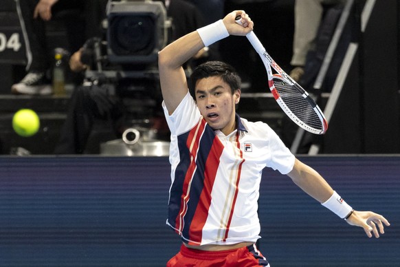 epa10269979 Brandon Nakashima of the United States in action during his round of 16 match against Stan Wawrinka of Switzerland at the Swiss Indoors tennis tournament in Basel, Switzerland, 27 October  ...
