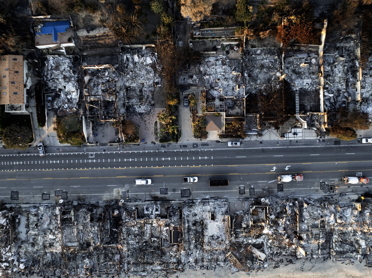 epa11827700 A photo taken by a drone shows an aerial view of a neighborhood destroyed by the Palisades wildfire in Malibu, California, USA, 15 January 2025. Multiple wildfires, which have already dest ...