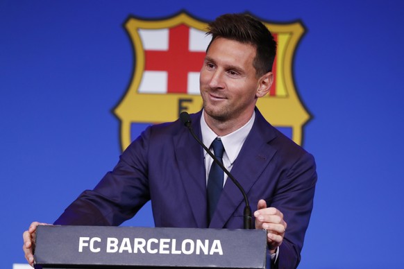 Lionel Messi smiles at the end of a press conference at the Camp Nou stadium in Barcelona, Spain, Sunday, Aug. 8, 2021. FC Barcelona had previously announced the negotiations with Lionel Messi had end ...