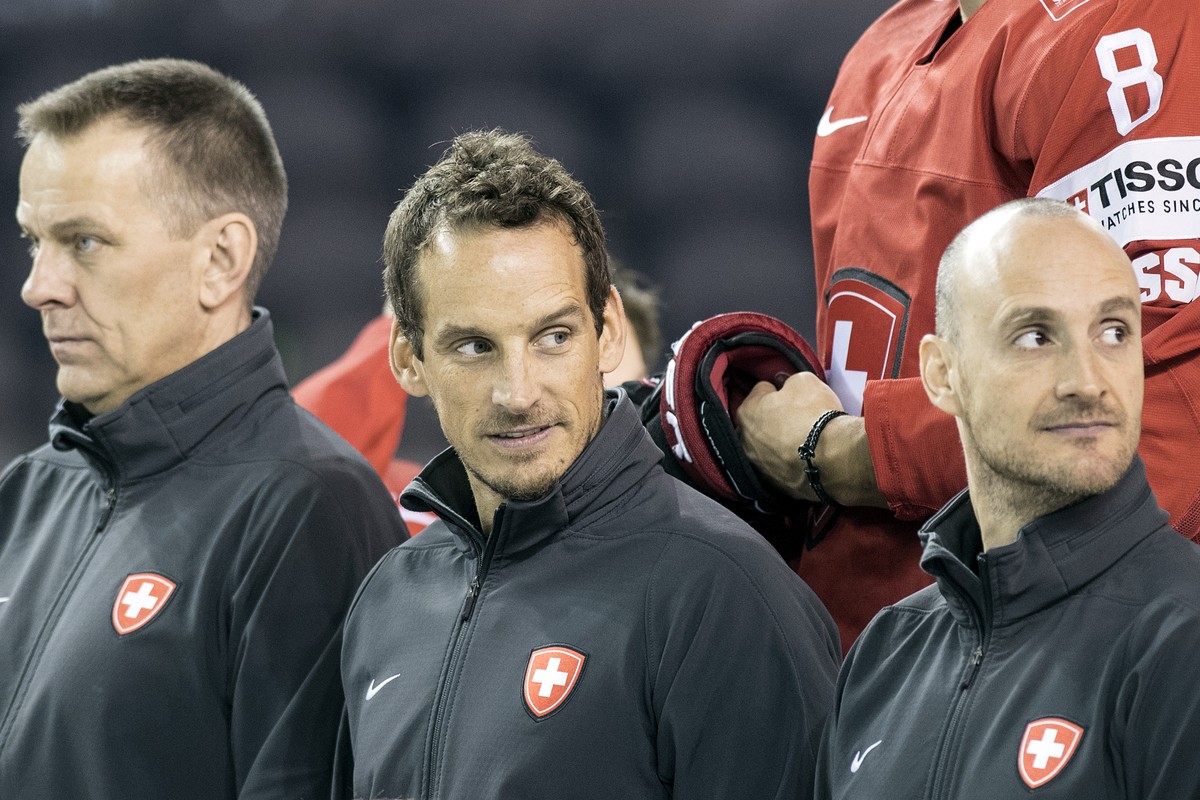 Switzerland's Tommy Albelin, assistant coach, Patrick Fischer, head coach and Christian Wohlwend, assistant coach, from left, pose during a photo session before a training session during the Ice  ...