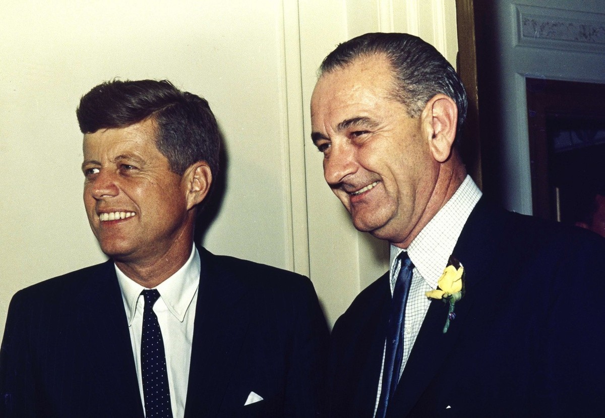 Democratic presidential nominee Sen. John F. Kennedy, left, and Kennedy's pick for vice presidential running mate, Lyndon B. Johnson, pose together at the convention headquarters hotel in Los Ang ...