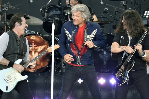 epa07708747 (L-R) John Shanks, Jon Bon Jovi and Phil X of US rock band Bon Jovi perform on stage during &#039;This house is not for sale&#039; tour concert at the Letzigrund stadium in Zurich, Switzer ...