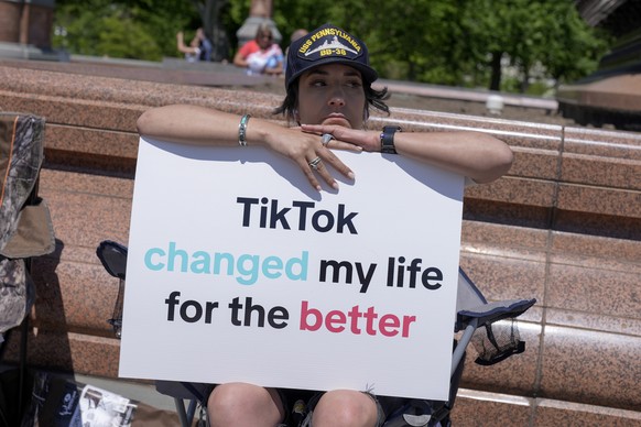 A TikTok content creator, sits outside the U.S. Capitol, Tuesday, April 23, 2024, in Washington as Senators prepare to consider legislation that would force TikTok&#039;s China-based parent company to ...