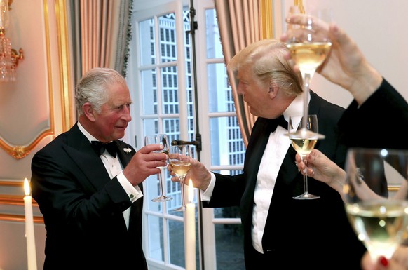 US President Donald Trump and Britain&#039;s Prince Charles toast, during the Return Dinner in Winfield House, the residence of the Ambassador of the United States of America to the UK, in Regent&#039 ...