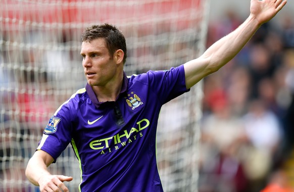 SWANSEA, WALES - MAY 17: James Milner of Manchester City celebrates after scoring his team&#039;s second goal during the Barclays Premier League match between Swansea and Manchester City at the Libert ...