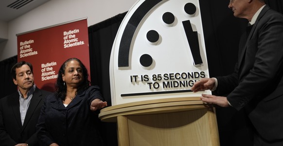 The Bulletin of the Atomic Scientists members, from left, Jon B. Wolfsthal, Asha M. George and Steve Fetter, reveal the Doomsday Clock, set to 85 seconds to midnight, during a news conference at the C ...