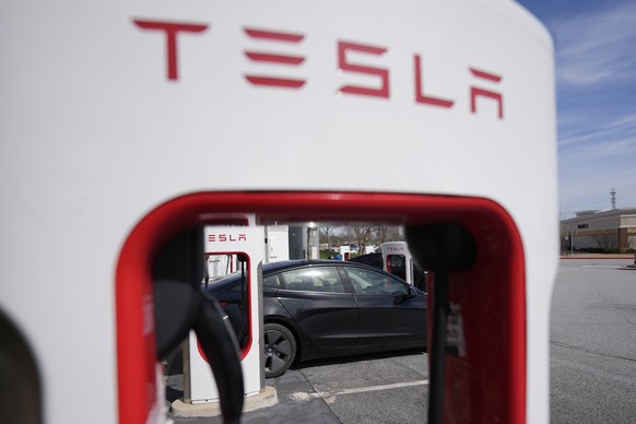 A Tesla vehicle is seen at a charging station, Wednesday, March 19, 2025, in Woodstock, Ga. (AP Photo/Mike Stewart)
Tesla Musk