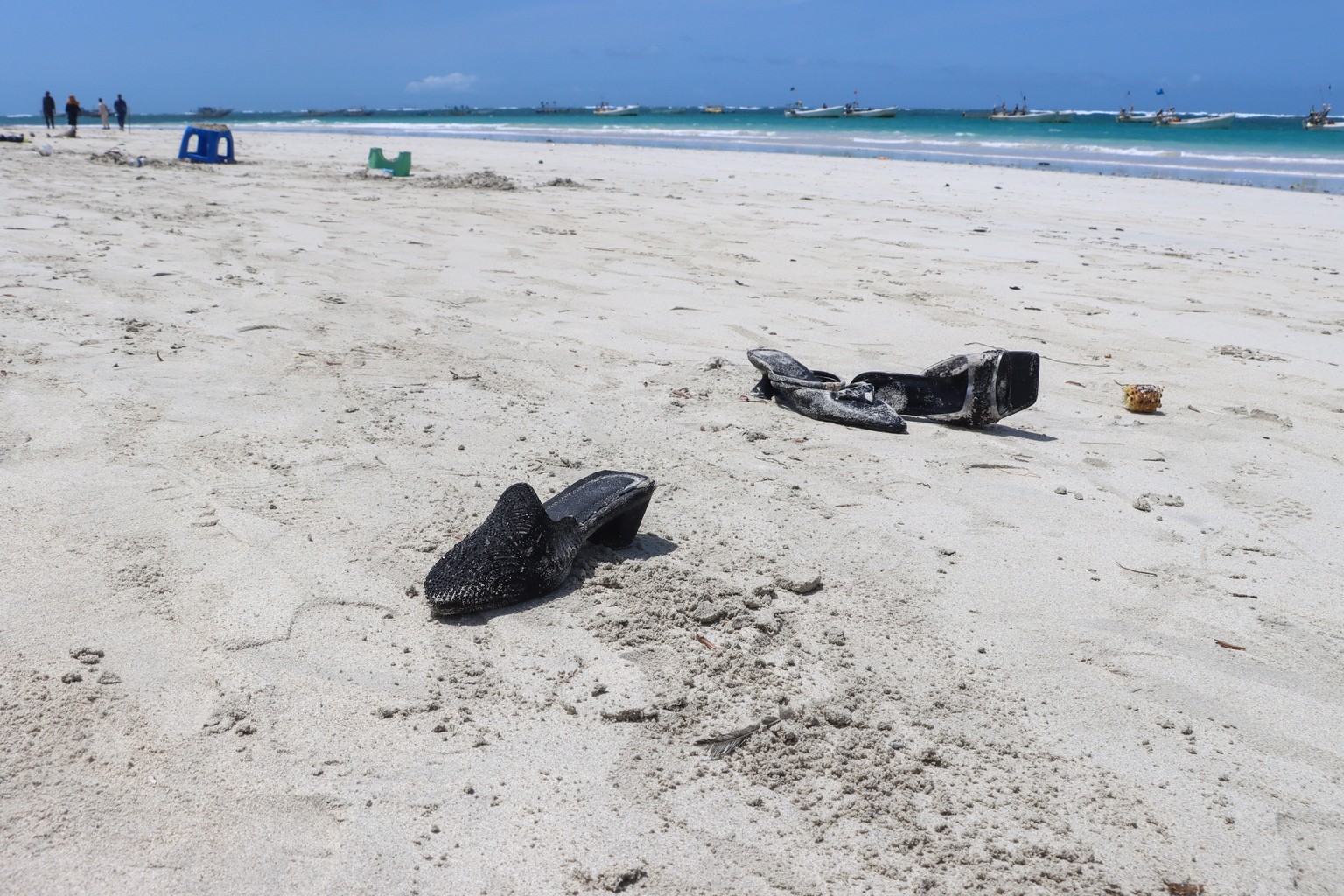 epa11521341 Shoes belonging to the victims of a suicide bombing litter a beach in Mogadishu, Somalia, 03 August 2024. At least 32 people were killed and more than 60 were wounded in a suicide bombing  ...