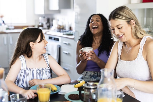 Cheerful family talking and having fun at home model released, Symbolfoto property released, WPEF08397