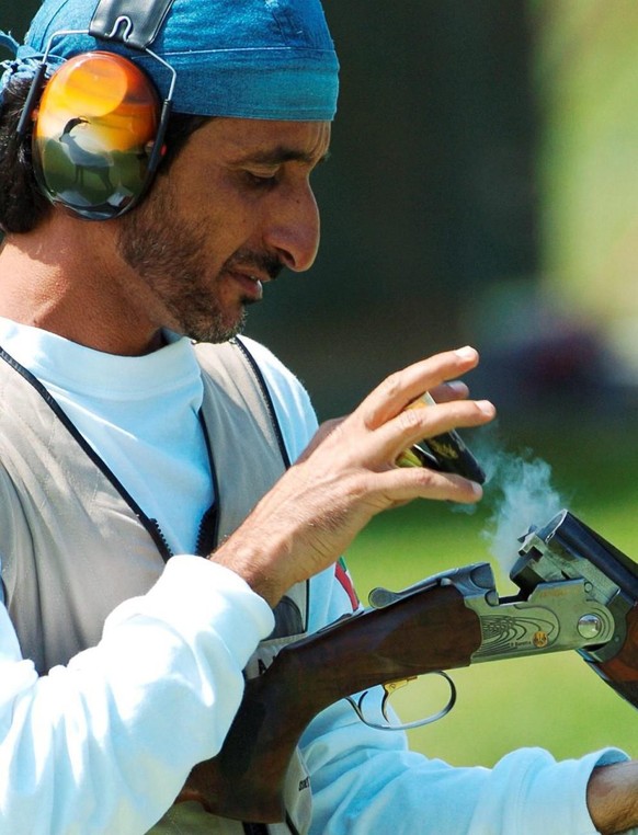 Ahmed Al Maktoum from United Arab Emirates unloads his gun after winning the gold medal in the olympic Double Trap Shooting in Athens, Tuesday 17 August 2004. Rajyavardhan S. Rathore from India took s ...