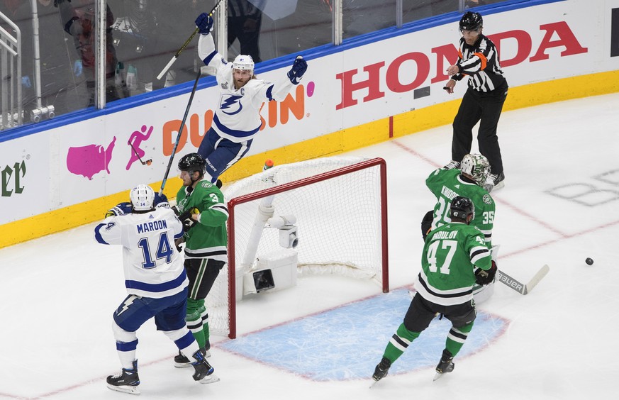 Tampa Bay Lightning center Steven Stamkos, top left, celebrates his goal against Dallas Stars goaltender Anton Khudobin (35) during the first period of Game 3 of the NHL hockey Stanley Cup Final, Wedn ...