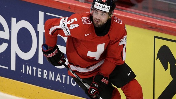 Switzerland&#039;s Philippe Furrer controls the puck, during the IIHF Ice Hockey World Championships quarterfinal game Switzerland vs Czech Republic at the Globe Arena in Stockholm, Sweden, on Thursda ...