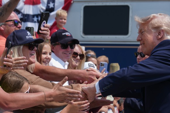 President Donald Trump greets supporters after arriving on a Freedom 250 train, Wednesday, July 1, 2026, in Medora, N.D. (AP Photo/Julia Demaree Nikhinson)
America 250 Trump Roosevelt Library