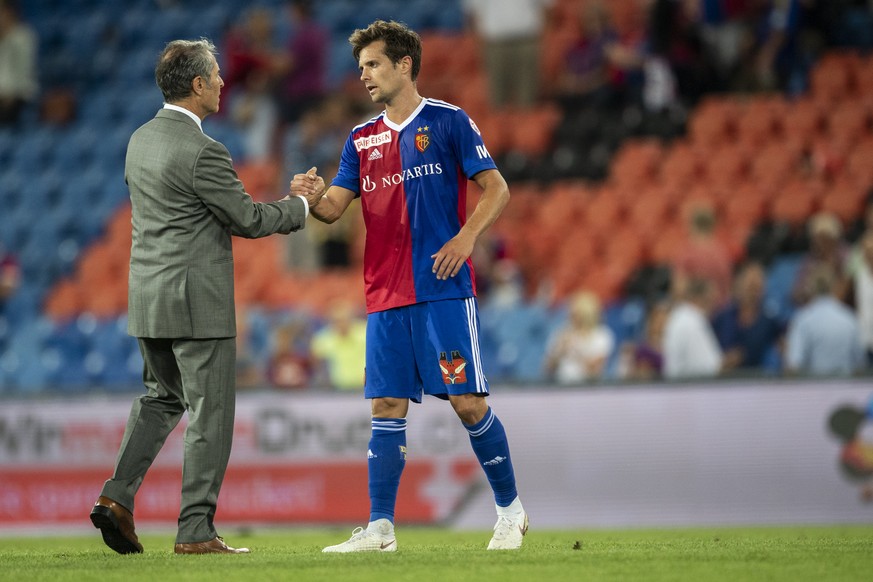 Basel&#039;s head coach Marcel Koller, left, speaks with Valentin Stocker during the UEFA Europa League third qualifying round second leg match between Switzerland&#039;s FC Basel 1893 and Netherland& ...