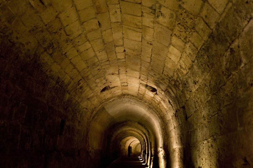 This photo taken on Sunday June, 19, 2011, shows a tunnel built by knights of the Templar order under the old port city of Acre, on the Mediterranean coast in northern Israel. Off the track beaten by  ...