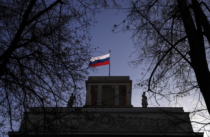 epa08493630 (FILE) - A Russian flag waves on top of the Russian Embassy in Berlin, Germany, 04 December 2019 (reissued 18 June 2020). In the murder case of an exiled Chechen in Berlin in Augusgt 2019, ...