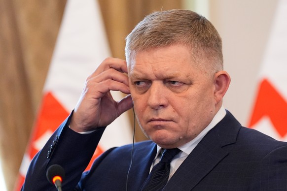 Slovakia's Prime Minister Robert Fico adjusts his headphone during a joint news conference with U.S. Secretary of State Marco Rubioin Bratislava, Slovakia, Sunday, Feb. 15, 2026. (AP Photo/Alex B ...
