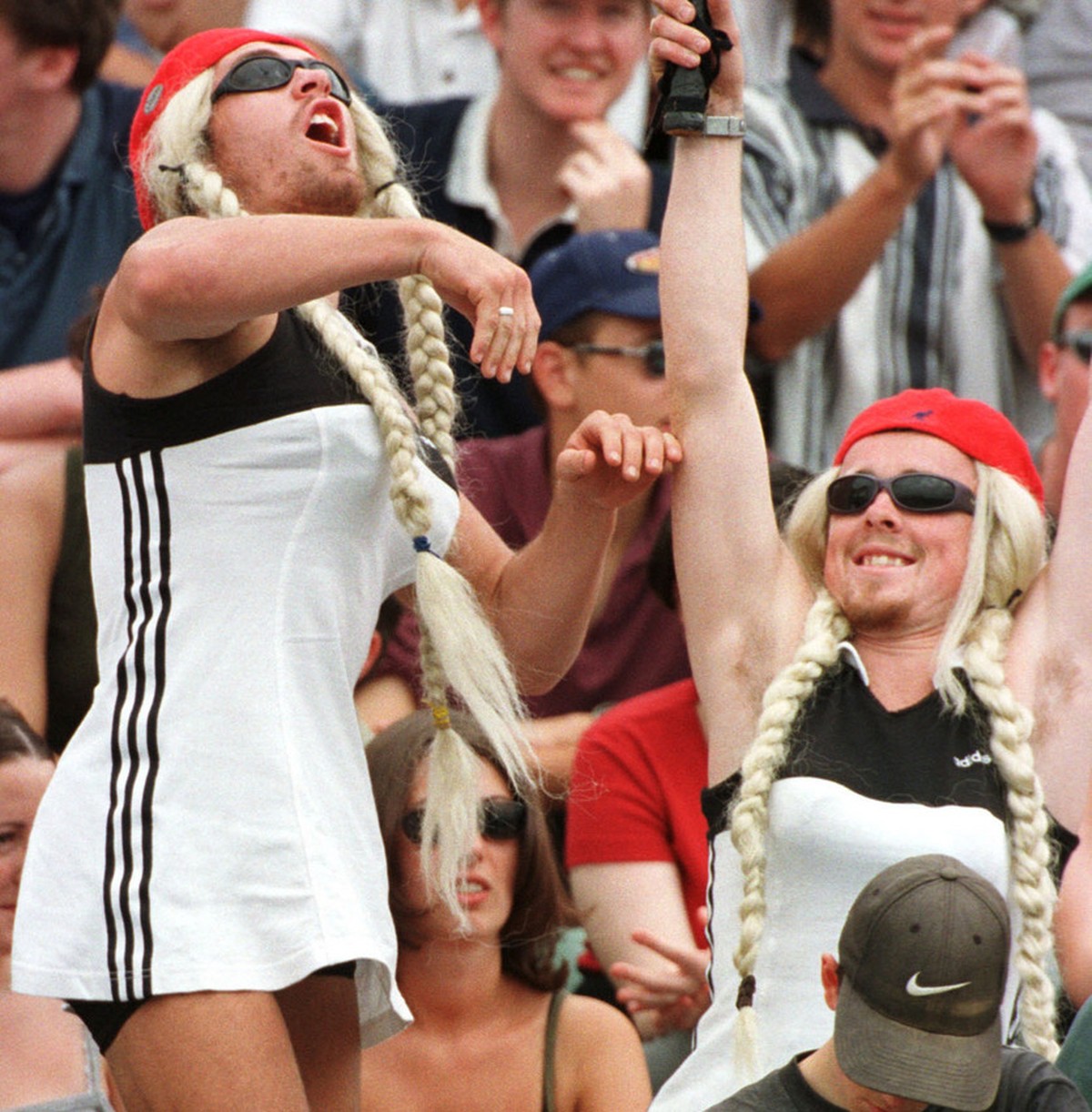 Anna Kournikova look-alikes clown in the stands before her match with Miho Saeki of Japan at the Australian Open Tennis Championships in Melbourne, Australia, Thursday, January 21, 1999.(AP Photo/Stev ...