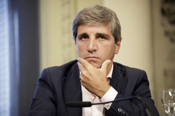 FILE - Then-Treasury Secretary Luis Caputo attends a press conference at the Casa Rosada presidential palace in Buenos Aires, Argentina, December.  August 30, 2016. Argentine President-elect Javier Milei announces...