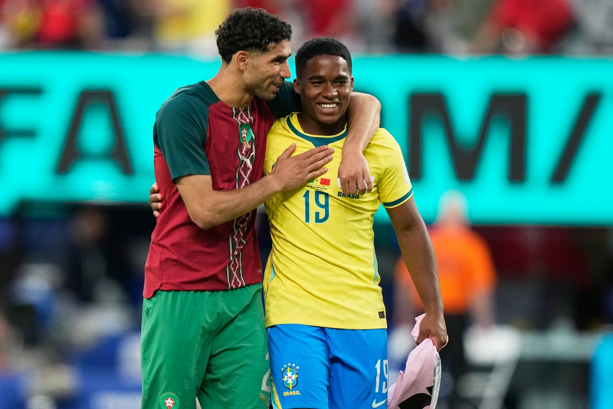 Morocco's Achraf Hakimi, left, talks with Brazil's Endrick at the end of the World Cup Group C soccer match between Brazil and Morocco in East Rutherford, N.J., near New York, Saturday, June ...
