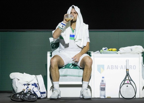 epa09046480 Stan Wawrinka of Switzerland reacts during a break as he plays Karen Khachanov of Russia on the second day of the ABN AMRO World Tennis Tournament in Rotterdam, The Netherlands, 02 March 2 ...