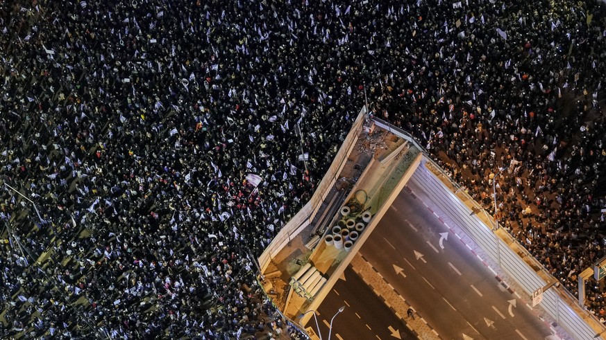 Tens of thousands of Israelis protest the plans of Prime Minister Benjamin Netanyahu's new government to overhaul the judicial system, in Tel Aviv, Israel, Saturday, January 21, 2023. Israeli med…