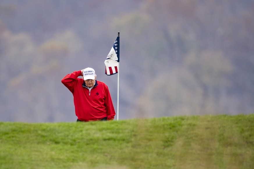 epa08834737 US President Donald J. Trump plays golf for the 143rd time since becoming president at the Trump National Golf Club in Sterling, Virginia, USA, 21 November 2020. The president continues to ...