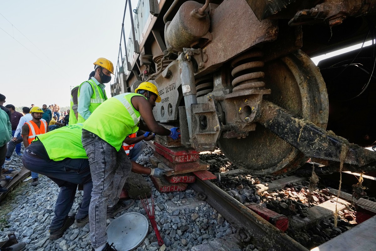 Indian railway workers repair the railway track after a speeding train hit a heard of wild elephant in the early morning, in Changjurai village east of Guwahati, India, Saturday, Dec. 20, 2025. (AP Ph ...