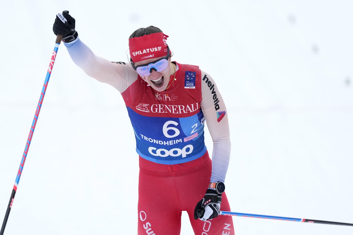 Nadine Faehndrich of Switzerland celebrates the third place with Anja Weber at the Women's Cross Country Team Sprint Classic at the Nordic World Championships in Trondheim, Norway, Wednesday, Mar ...