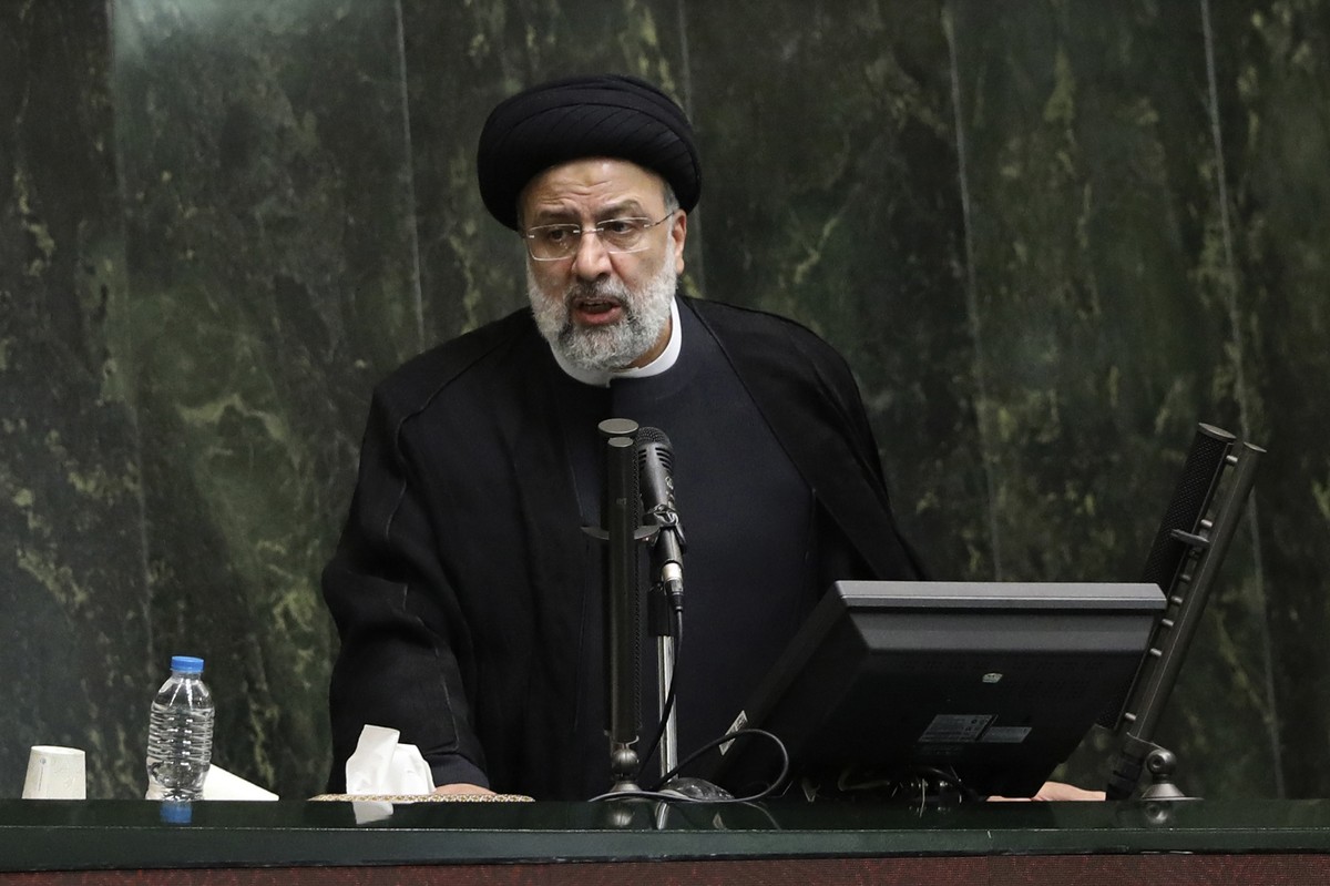 FILE - Iranian President Ebrahim Raisi defends his proposed ministers in a session of parliament, in Tehran, Iran, Wednesday, Aug. 25, 2021. The United States has hit Iran with a fresh set of sanction ...