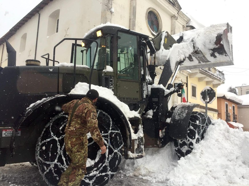 epa05727715 A snowplow at work along the main road covered with snow in Montereale, in Abruzzo region, central Italy, near the epicenter of new earthquakes earlier in the day, in L&#039;Aquila, Italy, ...