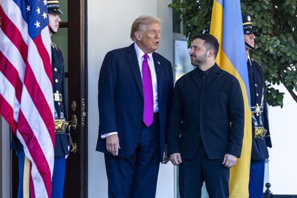 epaselect epa12460753 US President Donald Trump (L) greets Ukrainian President Volodymyr Zelensky as he arrives at the West Wing of the White House in Washington, DC, USA, 17 October 2025. The leaders ...