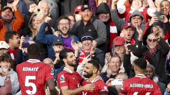 epa11671513 Mohamed Salah (2-R) of Liverpool celebrates scoring the 1-0 goal during the English Premier League match between Liverpool FC and Chelsea FC in Liverpool, Britain, 20 October 2024. EPA/ADA ...