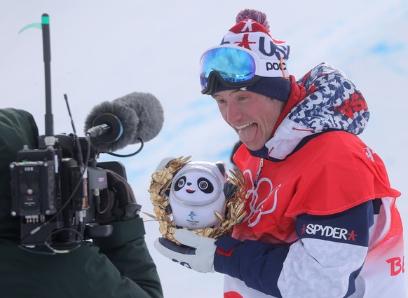 epa09770609 Bronze medalist Alex Ferreira of the USA reacts to camera after the Men&#039;s Freestyle Skiing Halfpipe final at the Zhangjiakou Genting Snow Park at the Beijing 2022 Olympic Games, Zhang ...