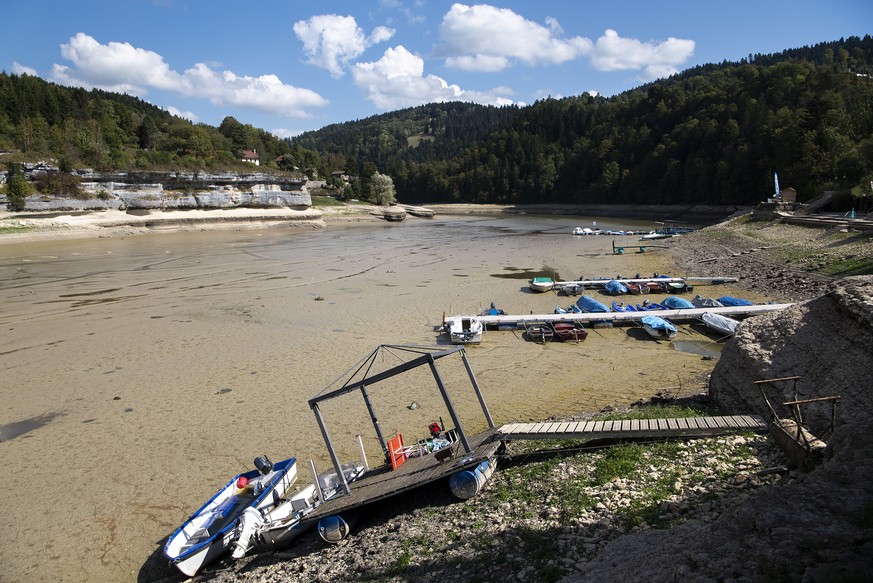 Stranded boats are pictured on the dried out shore of the Lac des Brenets in Les Brenets, Switzerland, this Tuesday, September 18, 2018. The lake is currently seven metres below its usual level and lo ...