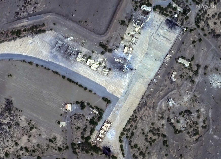 This Friday, Jan. 12, 2024 satellite image provided by Maxar Technologies shows an overview of destroyed shelters at Hudaydah aiirfield in Yemen. Yemen?s Houthi rebels have vowed fierce retaliation fo ...