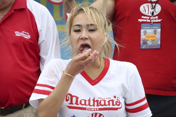 Miki Sudo competes at the Nathan&#039;s Famous Fourth of July International Hot Dog Eating contest at Coney Island, Friday, July 4, 2014, in New York. Sudo defeated the reigning champion Sonya Thomas  ...