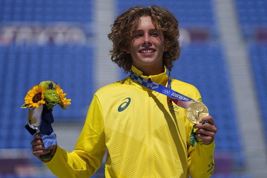 Gold medal winner Keegan Palmer of Australia poses for photos after the men&#039;s park skateboarding finals at the 2020 Summer Olympics, Thursday, Aug. 5, 2021, in Tokyo, Japan. (AP Photo/Ben Curtis)