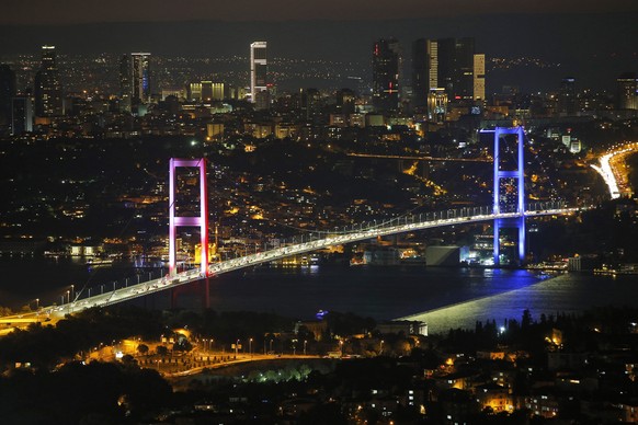 FILE - In this Friday July 15, 2016 file photo, Istanbul&#039;s iconic Bosporus Bridge is lit in the colours of the French flag in solidarity with the victims of the attack in Nice, France, a few hour ...